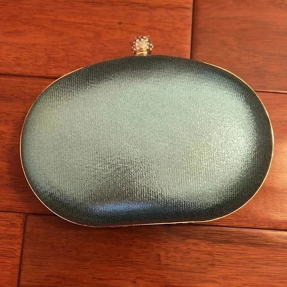 Ramla Aquamarine blue Jeweled bag with removable handles